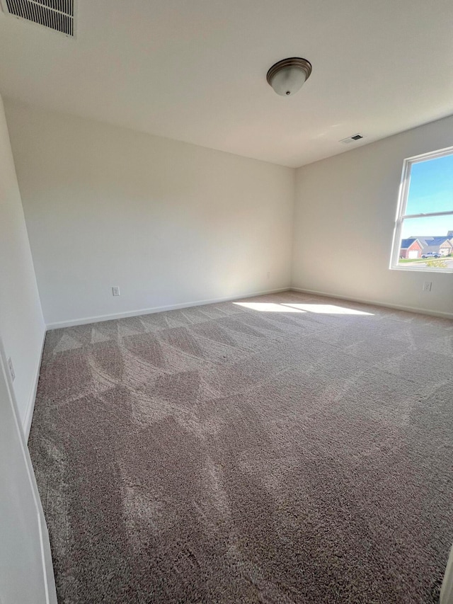 unfurnished room with carpet floors