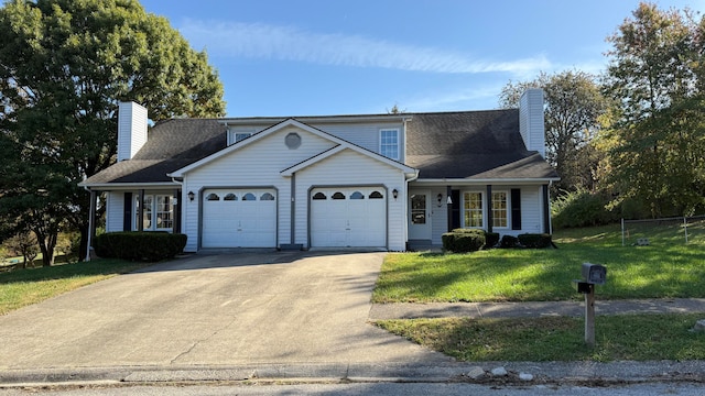 view of front of house featuring a front yard and a garage