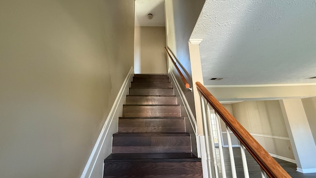 staircase featuring hardwood / wood-style floors