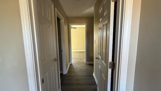 hall with dark hardwood / wood-style floors