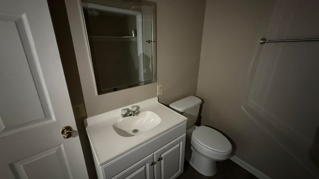 bathroom featuring vanity and toilet