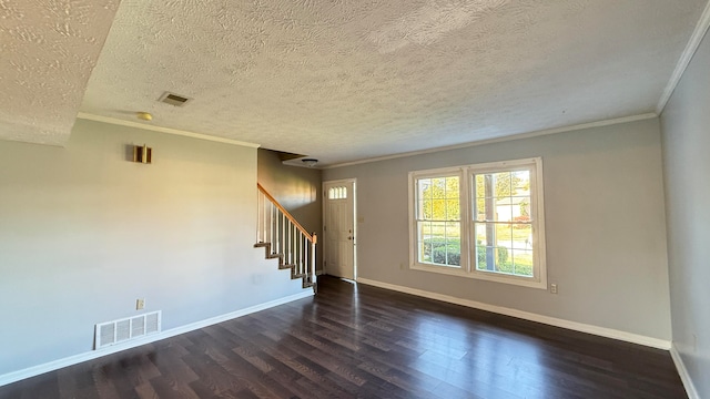 empty room with crown molding, a textured ceiling, and dark hardwood / wood-style floors