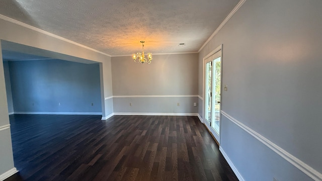 unfurnished room featuring crown molding, dark hardwood / wood-style floors, a chandelier, and a textured ceiling