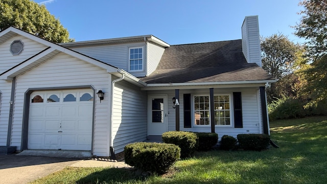 view of front facade with a front lawn and a garage