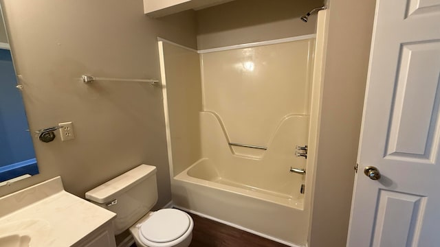 full bathroom with vanity, toilet, wood-type flooring, and shower / bath combination