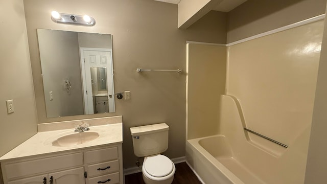 full bathroom with toilet, vanity, and washtub / shower combination