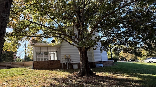 view of home's exterior featuring a lawn