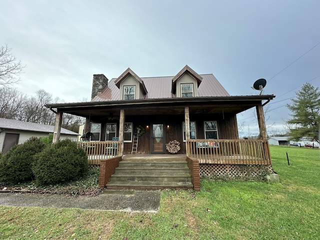 view of front of house with covered porch and a front lawn