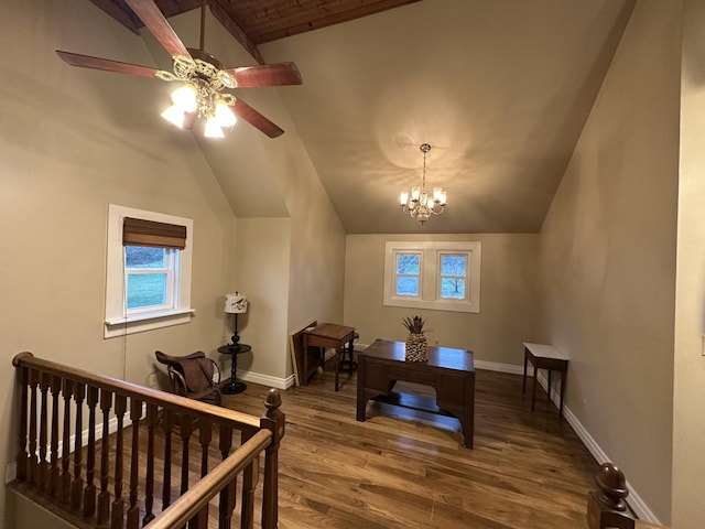 interior space featuring ceiling fan with notable chandelier, wood-type flooring, and lofted ceiling