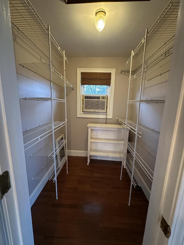 walk in closet featuring cooling unit and dark hardwood / wood-style floors