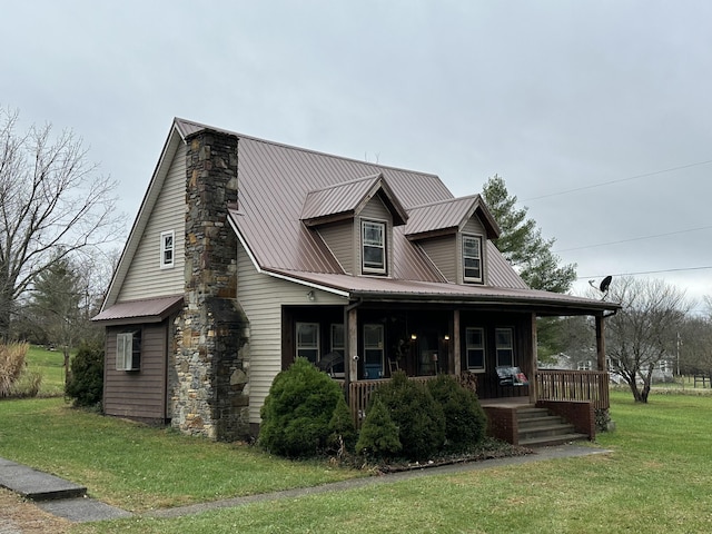 view of front of property with covered porch and a front yard