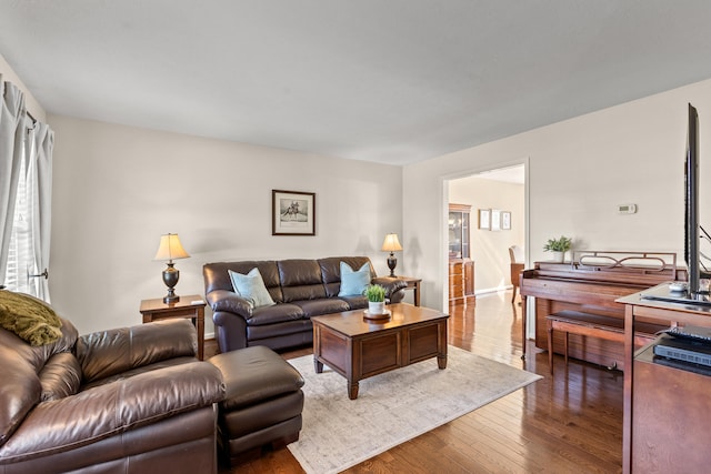 living room with dark hardwood / wood-style flooring