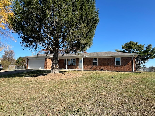 ranch-style home with a garage and a front yard