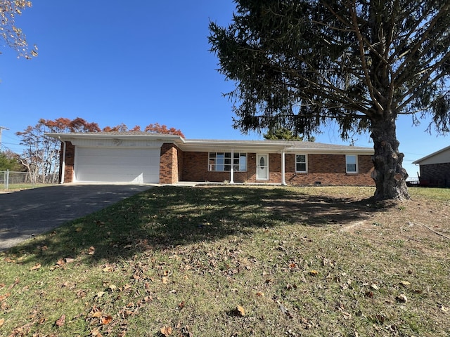 single story home with a front lawn and a garage