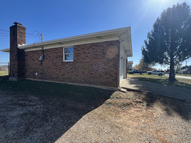 view of property exterior with a garage