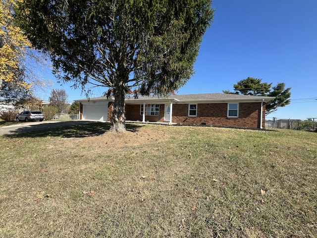 single story home featuring a garage and a front lawn