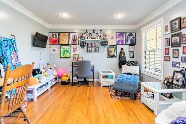 home office featuring hardwood / wood-style floors, crown molding, and a textured ceiling