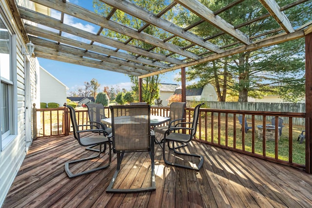 deck with a yard and a pergola