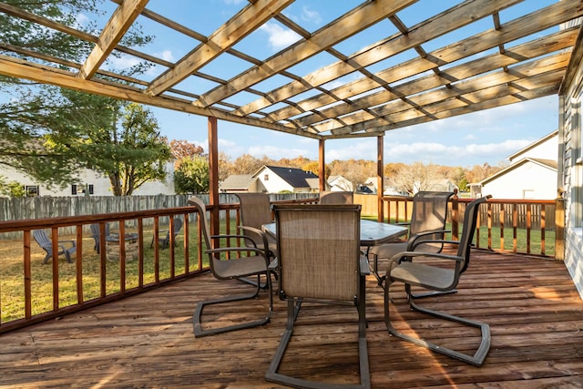 deck with a yard and a pergola