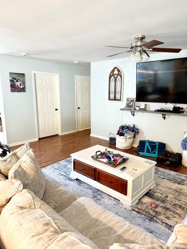 living room featuring hardwood / wood-style flooring and ceiling fan