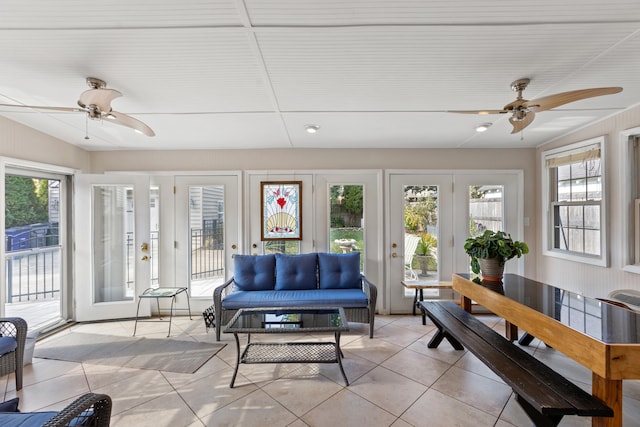 tiled living room featuring ceiling fan