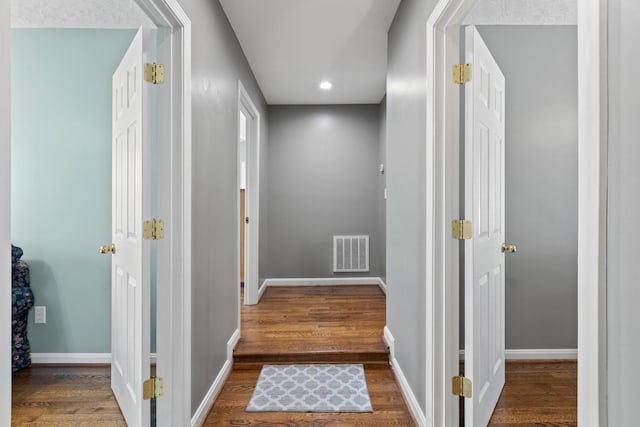 hall featuring dark wood-type flooring