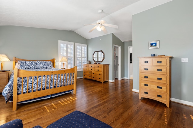 bedroom with ceiling fan, vaulted ceiling, and dark hardwood / wood-style flooring