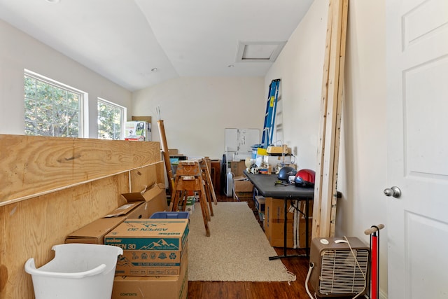 miscellaneous room featuring lofted ceiling and hardwood / wood-style floors