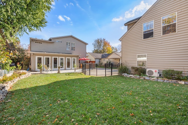 rear view of property with a patio area, french doors, a pool, ac unit, and a lawn