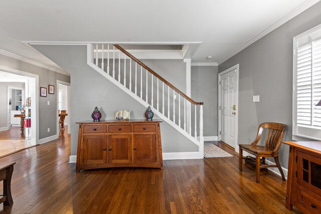 entryway with crown molding and dark hardwood / wood-style flooring