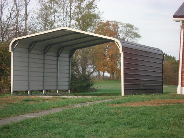 view of car parking featuring a yard and a carport