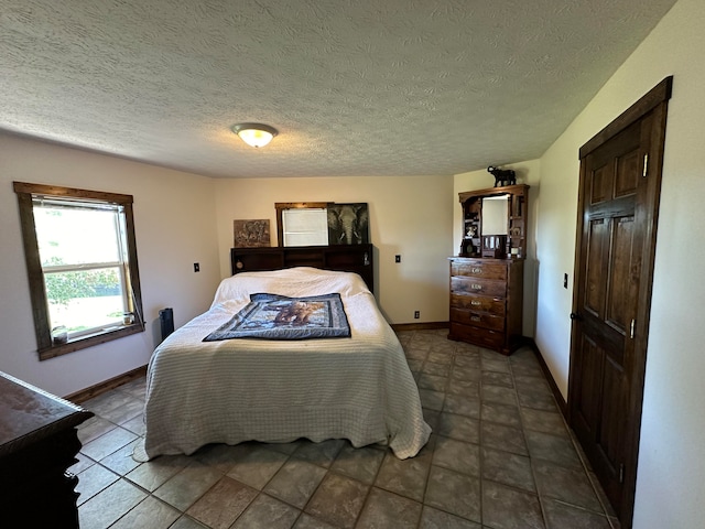 bedroom featuring a textured ceiling