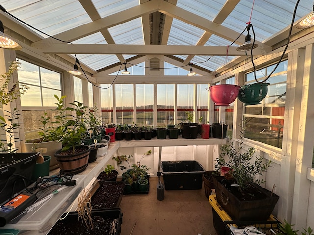 sunroom / solarium featuring lofted ceiling