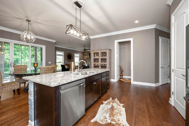 kitchen with dishwasher, sink, pendant lighting, and dark hardwood / wood-style floors