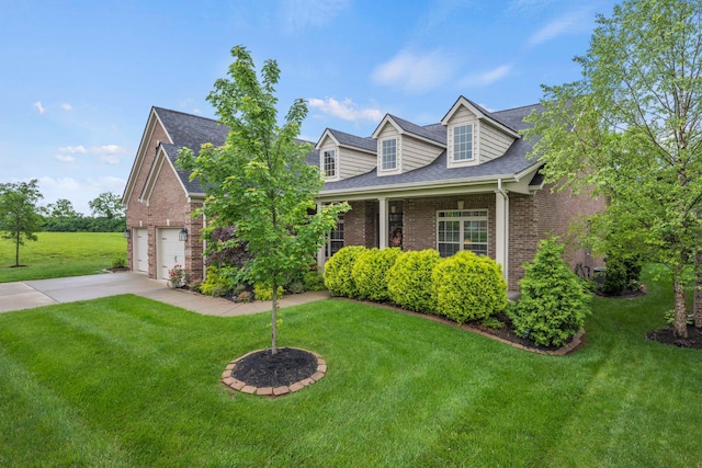 new england style home featuring a front lawn and a garage