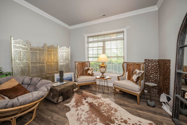 living area with crown molding and dark hardwood / wood-style flooring