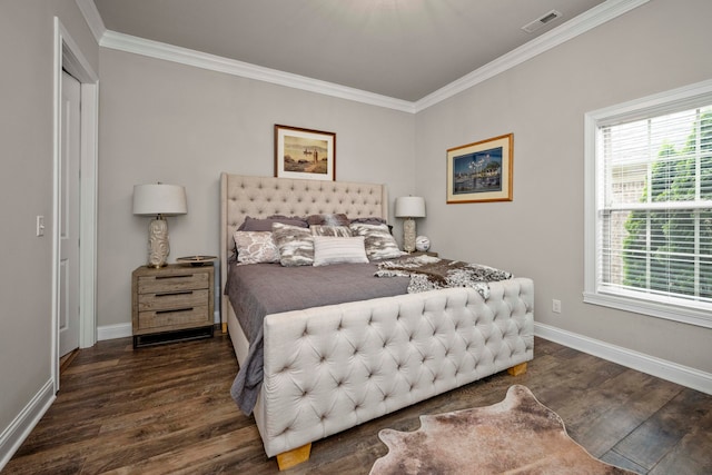 bedroom featuring ornamental molding and dark hardwood / wood-style flooring