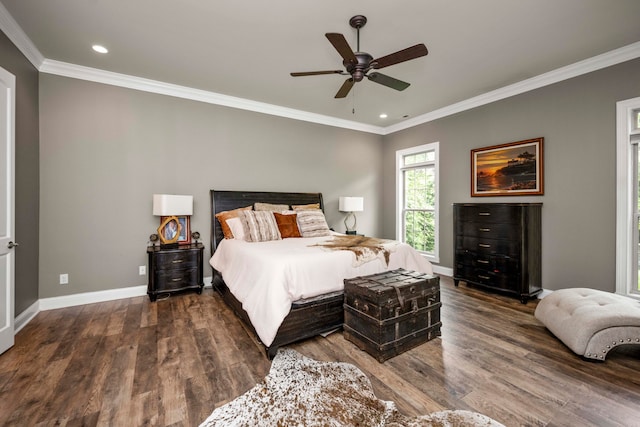 bedroom featuring crown molding, dark hardwood / wood-style floors, and ceiling fan