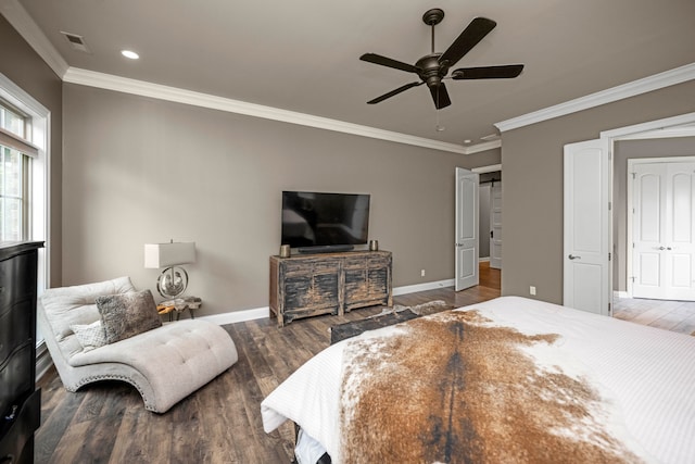 bedroom with dark wood-type flooring, crown molding, and ceiling fan