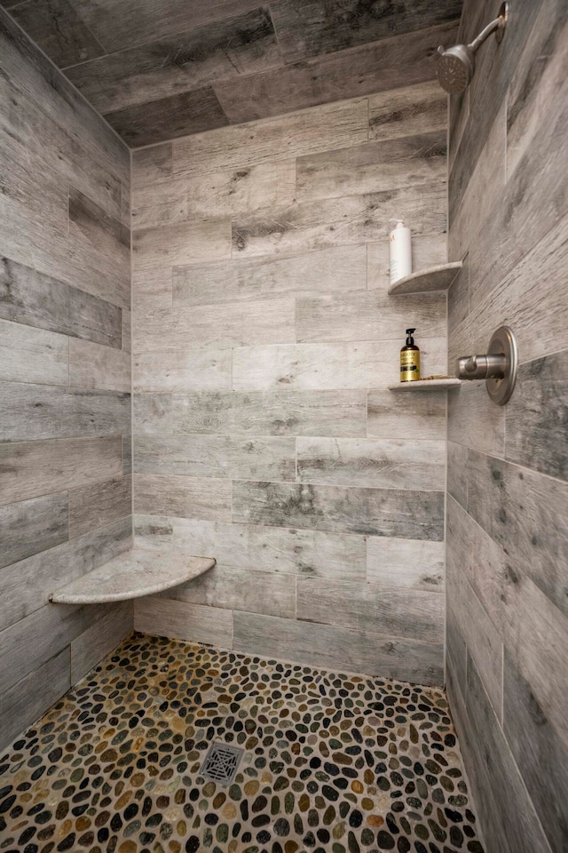 bathroom with a tile shower