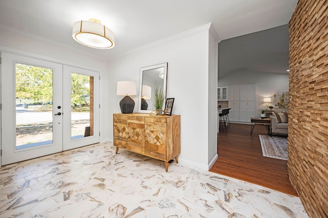 foyer featuring french doors, hardwood / wood-style flooring, and ornamental molding