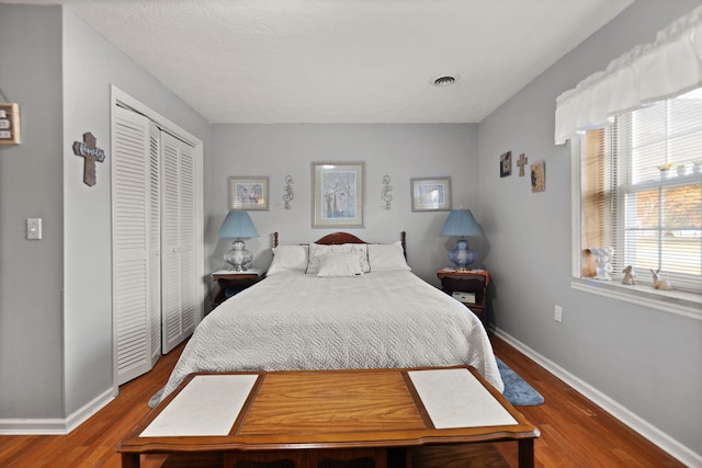 bedroom featuring a closet and hardwood / wood-style floors