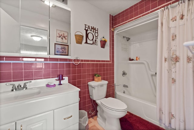 full bathroom featuring vanity, tile walls, shower / bath combo with shower curtain, and toilet