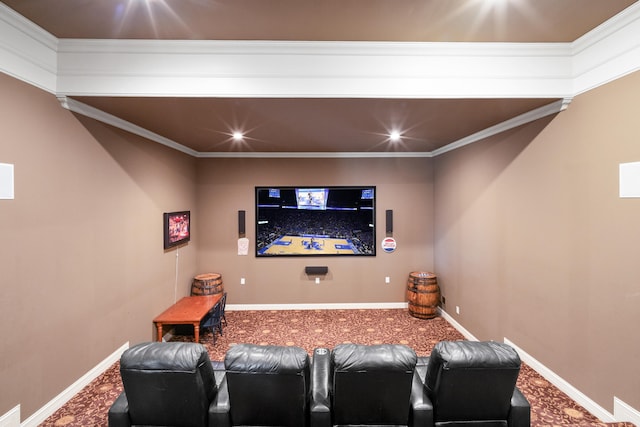 carpeted cinema room featuring ornamental molding