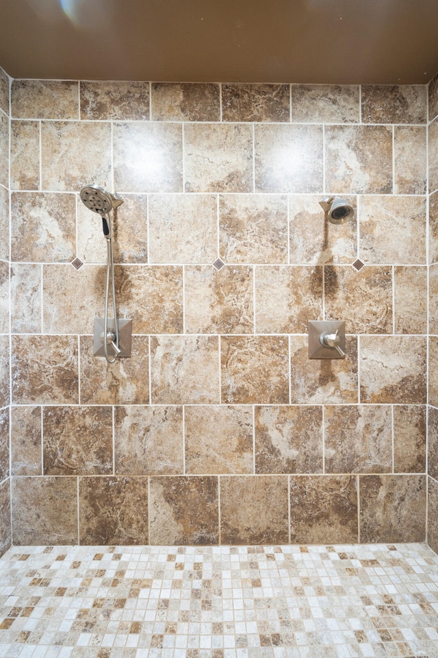 bathroom with tiled shower