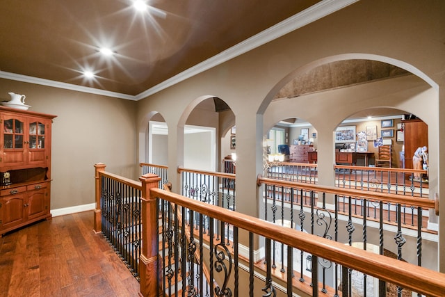 corridor featuring dark hardwood / wood-style flooring and ornamental molding