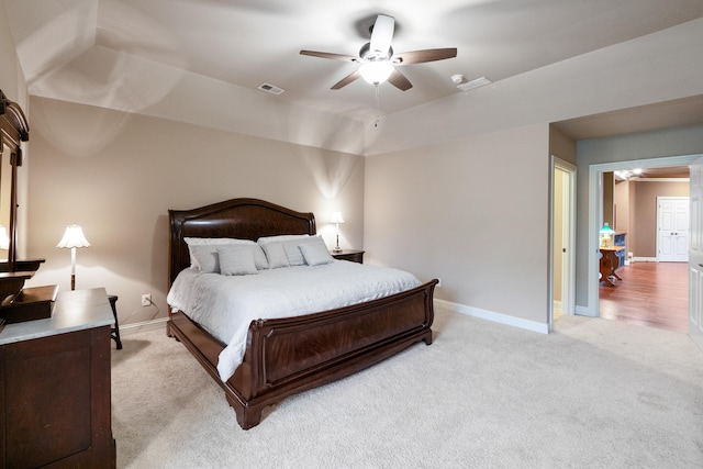 bedroom with light carpet and ceiling fan