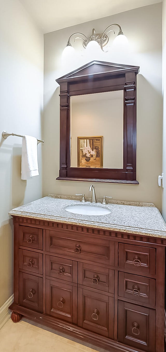 bathroom featuring tile patterned flooring and vanity