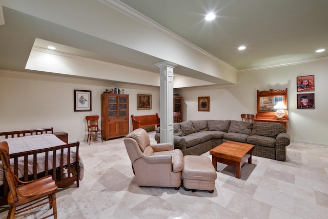 living room featuring ornamental molding and ornate columns