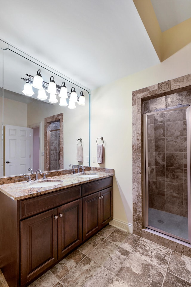 bathroom featuring vanity and a shower with shower door